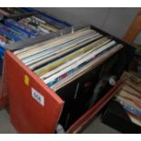 A box of pop LP records.