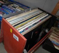 A box of pop LP records.