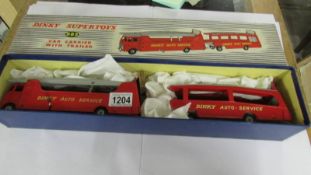 A Dinky 983 car carrier with trailer, in very good condition and in original box.