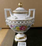 A fine Dresden porcelain two handled urn signed by the artist.