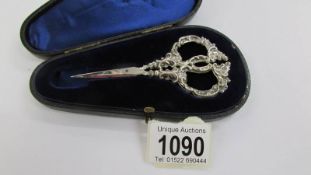 A pair of Victorian silver handled scissors in case.