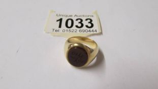A yellow metal ring (tests as 9ct gold) size M,
