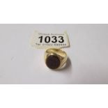 A yellow metal ring (tests as 9ct gold) size M,