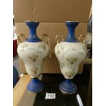 A pair of two handled Staffordshire vases.