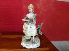 A Capodimonte figure.