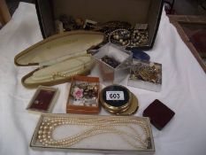 A mixed lot of costume jewellery including nursing buckle, R.A.F brooches etc.