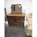 A solid oak bedroom chest of drawers with matching mirror (collect only).
