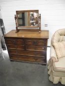 A solid oak bedroom chest of drawers with matching mirror (collect only).