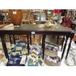 A dark wood stained long nest of table with leather inset tops (collect only).