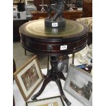 A dark wood stained drum side table with gilded green leather top. (collect only).