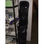 A snowboard with travel bag.