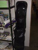 A snowboard with travel bag.