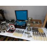 A large quantity of silver plate including canteen of cutlery, teapot, fish knives and forks etc.