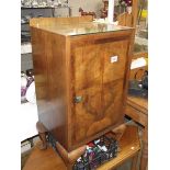 A figured walnut shelved cabinet with glass top.