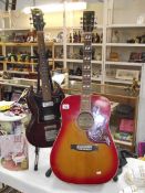 An acoustic guitar (Larome by Robert) and an electric guitar (collect only).