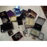 A mixed lot of costume jewellery including pendants, earrings etc.
