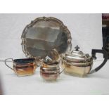 A 3 piece silver plate tea set on tray.