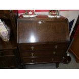 A 1930's oak bureau.