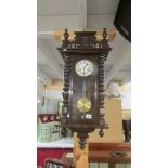 A mahogany wall clock.