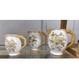 A set of 3 Losel Ware graduated jugs with dragon handles.