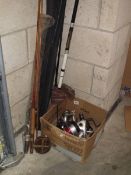 An old cane fishing rod, a wooden real, various used reels and rods including ?Shakespeare.