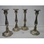 A good set of 4 Victorian EPNS candlesticks in good condition.