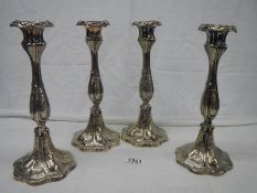 A good set of 4 Victorian EPNS candlesticks in good condition.