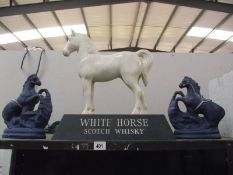 A large plastic White Horse Scotch Whisky horse a/f and 2 blue pottery horses, 1 a/f.