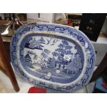 A large blue and white willow pattern meat platter, a/f.