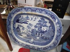 A large blue and white willow pattern meat platter, a/f.