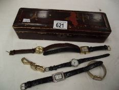 A lacquered box containing 6 wrist watches.