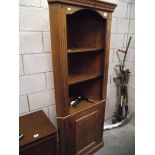 A dark pine corner cupboard, (collect only).