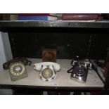 A quantity of vintage telephones including Royal Albert and a clock.