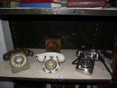 A quantity of vintage telephones including Royal Albert and a clock.