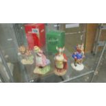 2 Royal Doulton and 2 Beswick figures including Alice in Wonderland and the Cheshire cat.