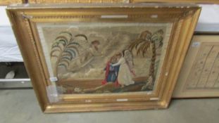 A framed and glazed religious embroidery, frame a/f.