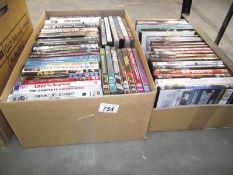 A box of assorted DVD's.