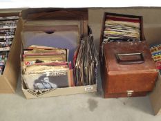 A quantity of 45 rpm and 78 rpm records.