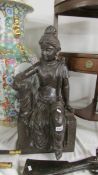 A large bronzed resin figure of an Indian female - hight 68cm. (collect only).