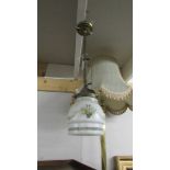 A Victorian brass ceiling light with on/off tags and complete with shade.