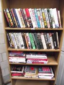 A large collection of books, many military related.