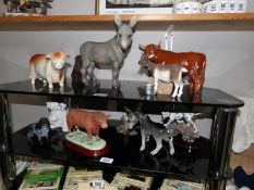 A mixed lot of farmyard animals including Coopercraft bull, Border fine arts Bull, donkeys, goat,