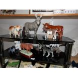 A mixed lot of farmyard animals including Coopercraft bull, Border fine arts Bull, donkeys, goat,