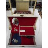 A box of costume jewellery and a musical jewellery box.