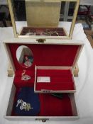 A box of costume jewellery and a musical jewellery box.