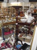 A mahogany torchere/plant stand on tripod base (collect only).