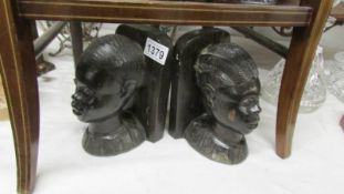 A pair of African head book ends.
