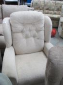 An electric reclining arm chair