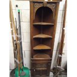 A dark oak corner cupboard (collect only).