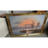 A gilt framed oil on canvas lake scene signed G Brahwer.